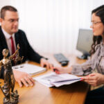 Divorce attorney sitting with client